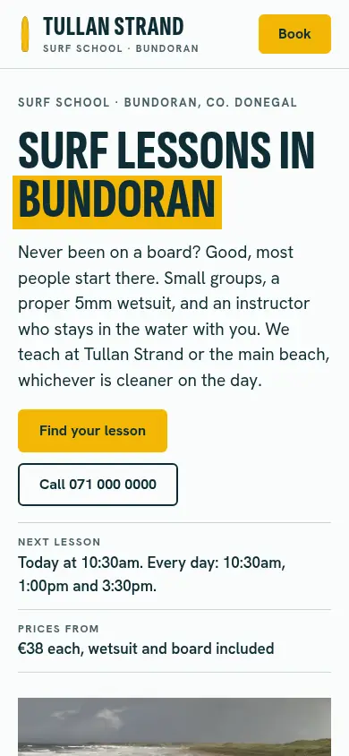 The redesigned Tullan Strand Surf School site on a phone.